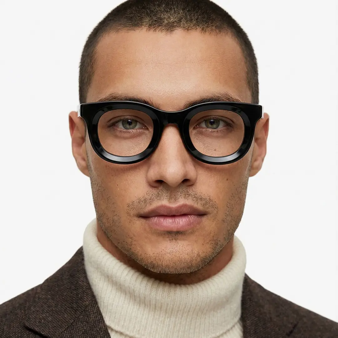 Front view of male wearing black round eyeglasses, confident expression, RA0182406
