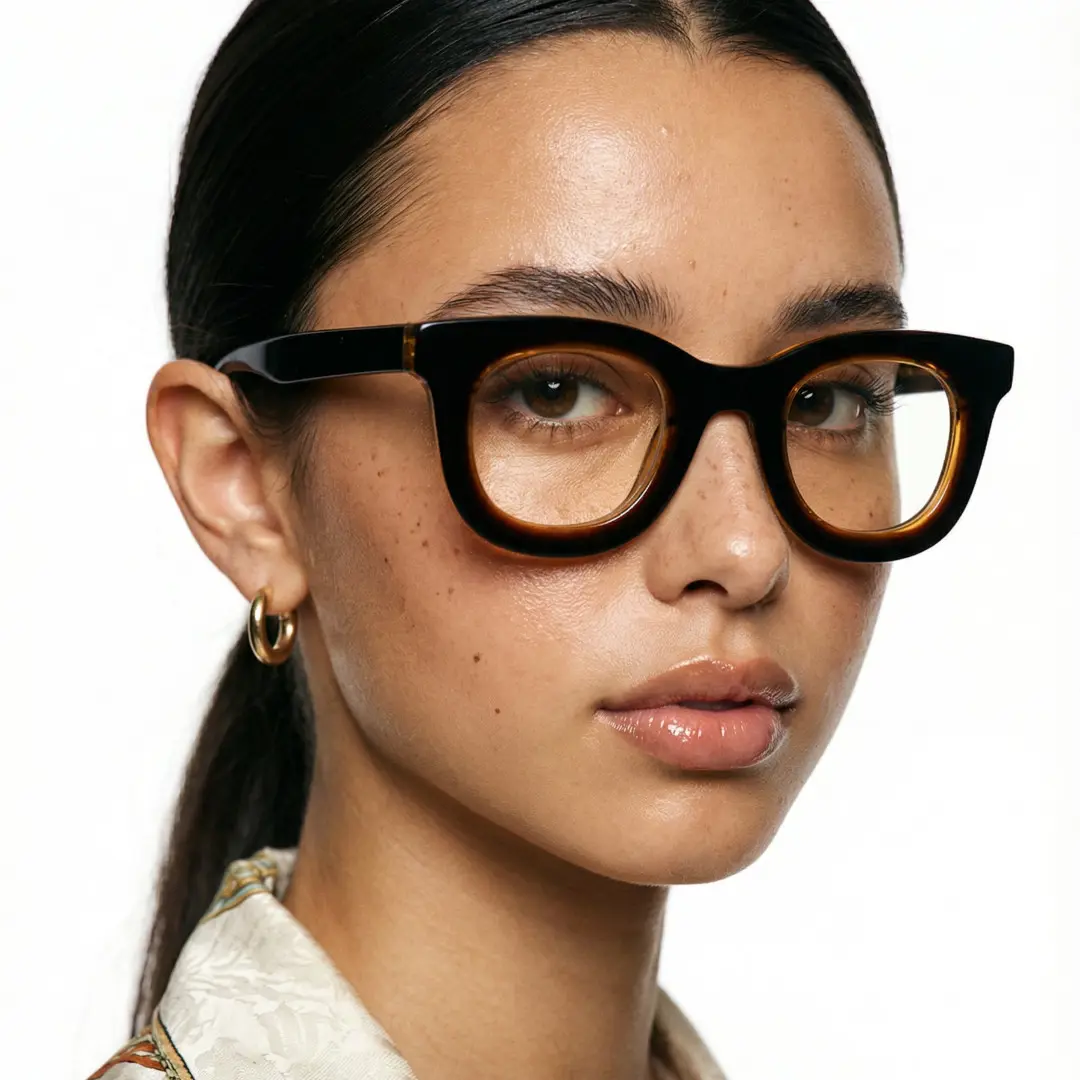 Three-quarter view of female wearing brown round eyeglasses, neutral expression, RA0182406