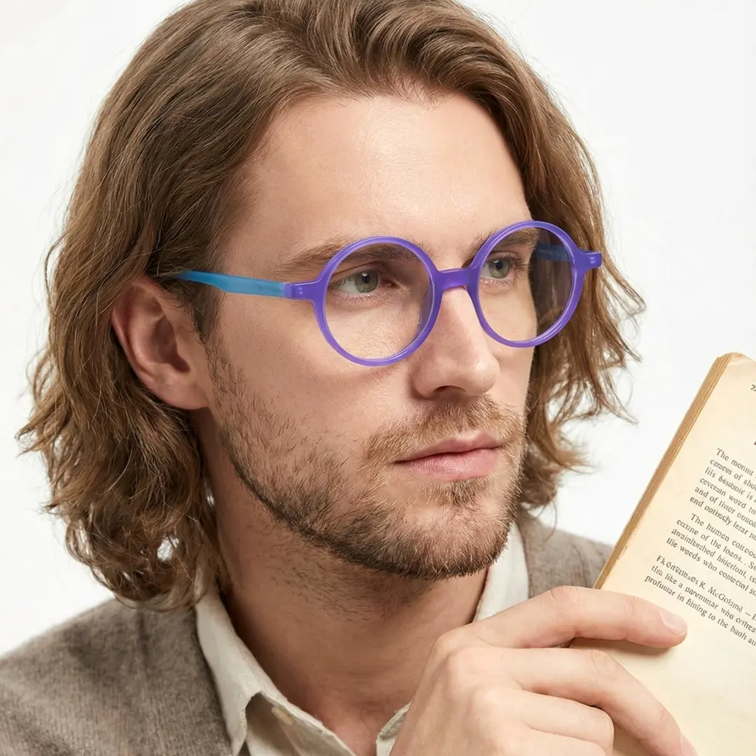 Face close-up of male wearing purple round eyeglasses, relaxed expression, RA0222310