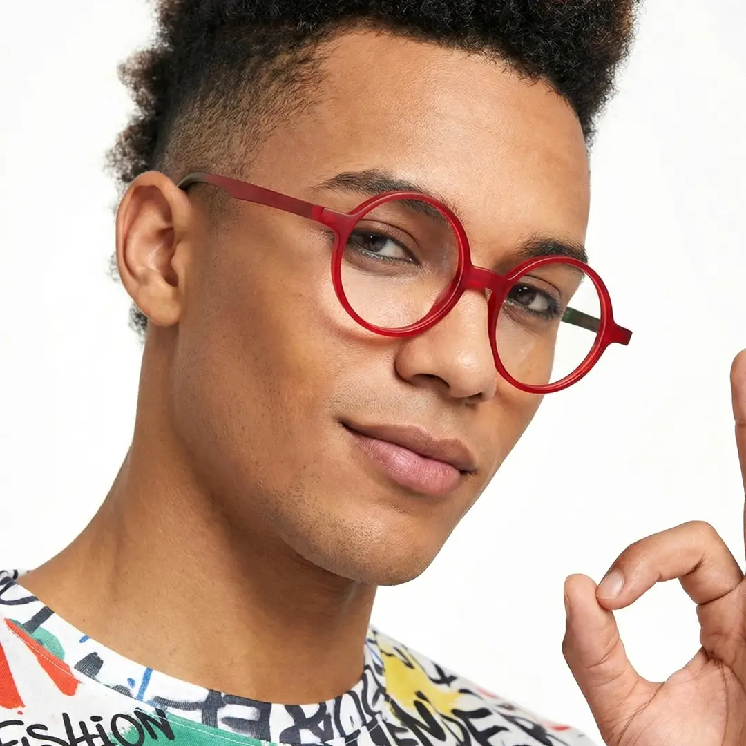 Male wearing colorful red round acetate eyeglasses, relaxed expression. SPU: RA0222310
