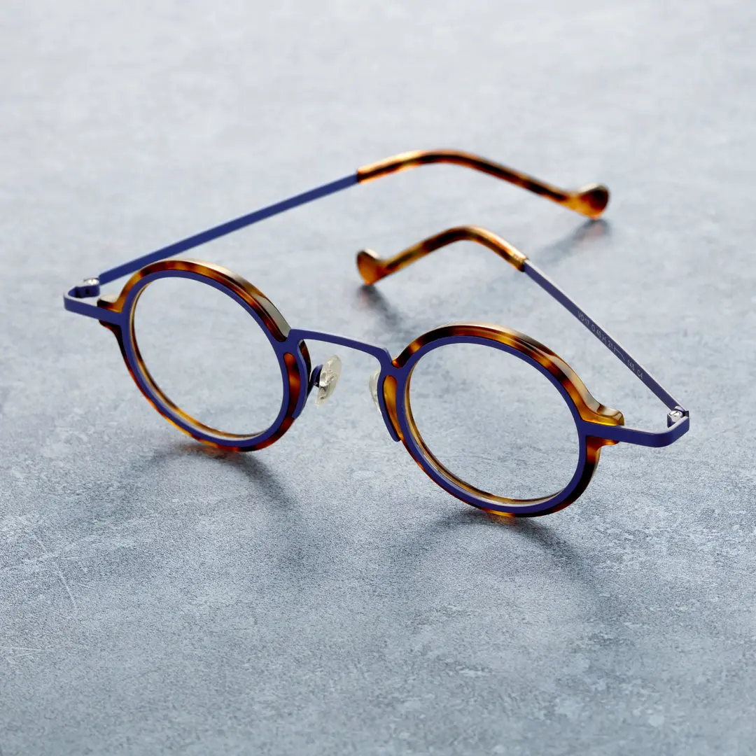 Scene view of Kyire vintage round acetate eyeglasses in blue tortoise. SPU: RA0302402