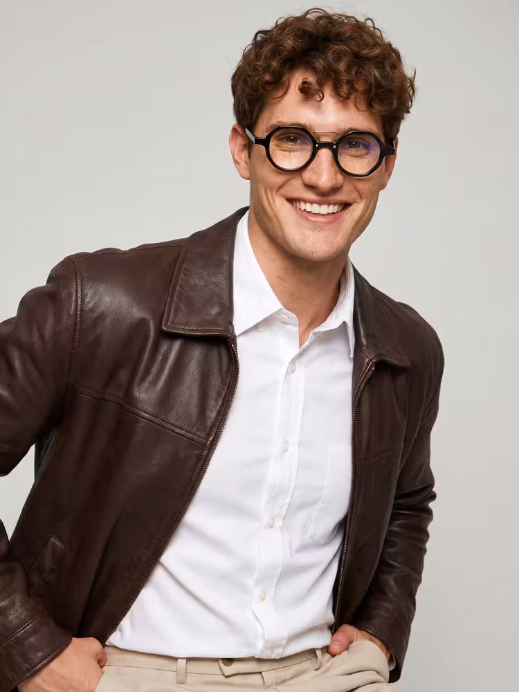 Male model wearing vintage black round acetate eyeglasses in a studio setting. SPU: RA0302411