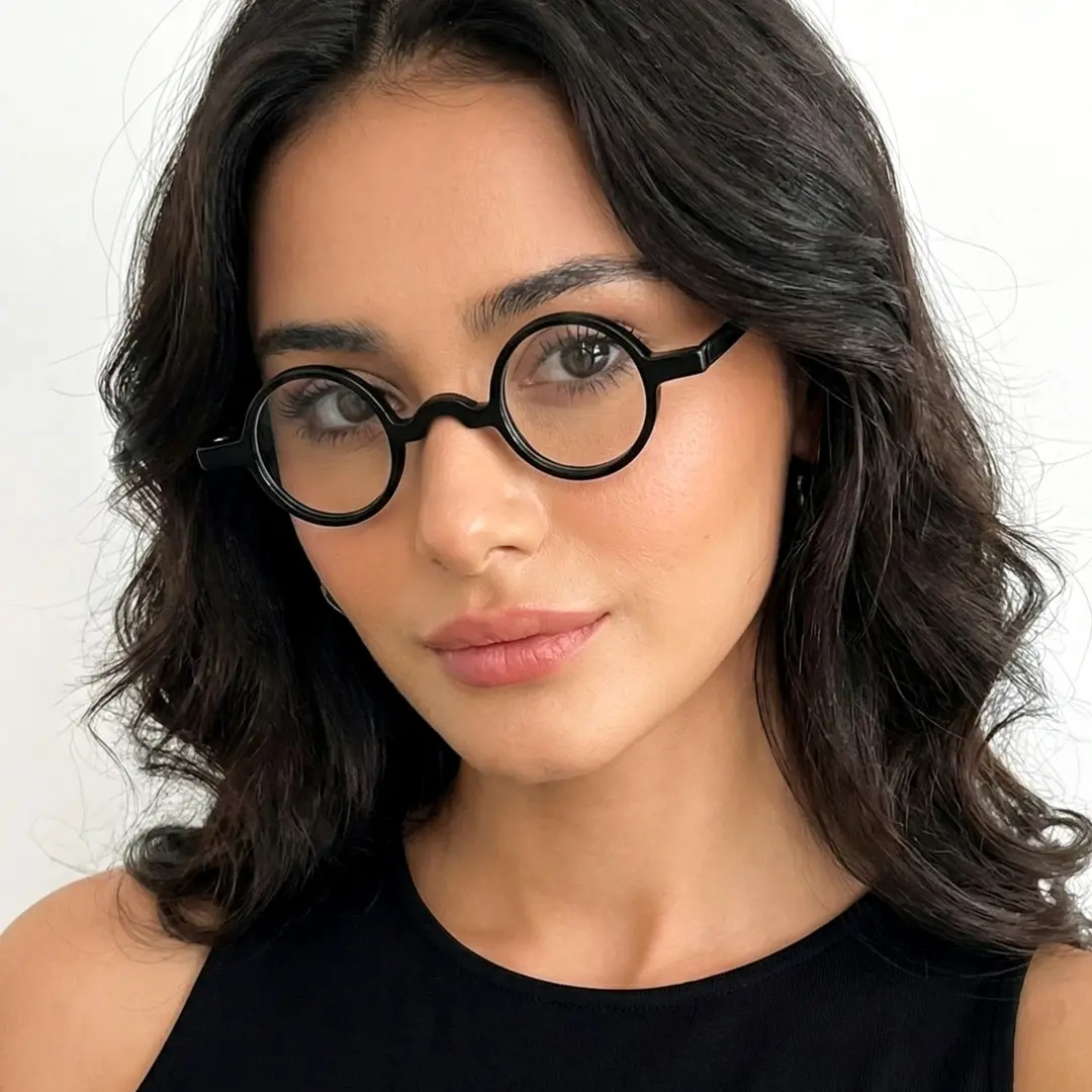 Female wearing vintage black round acetate eyeglasses, friendly smile. SPU: RA0402411