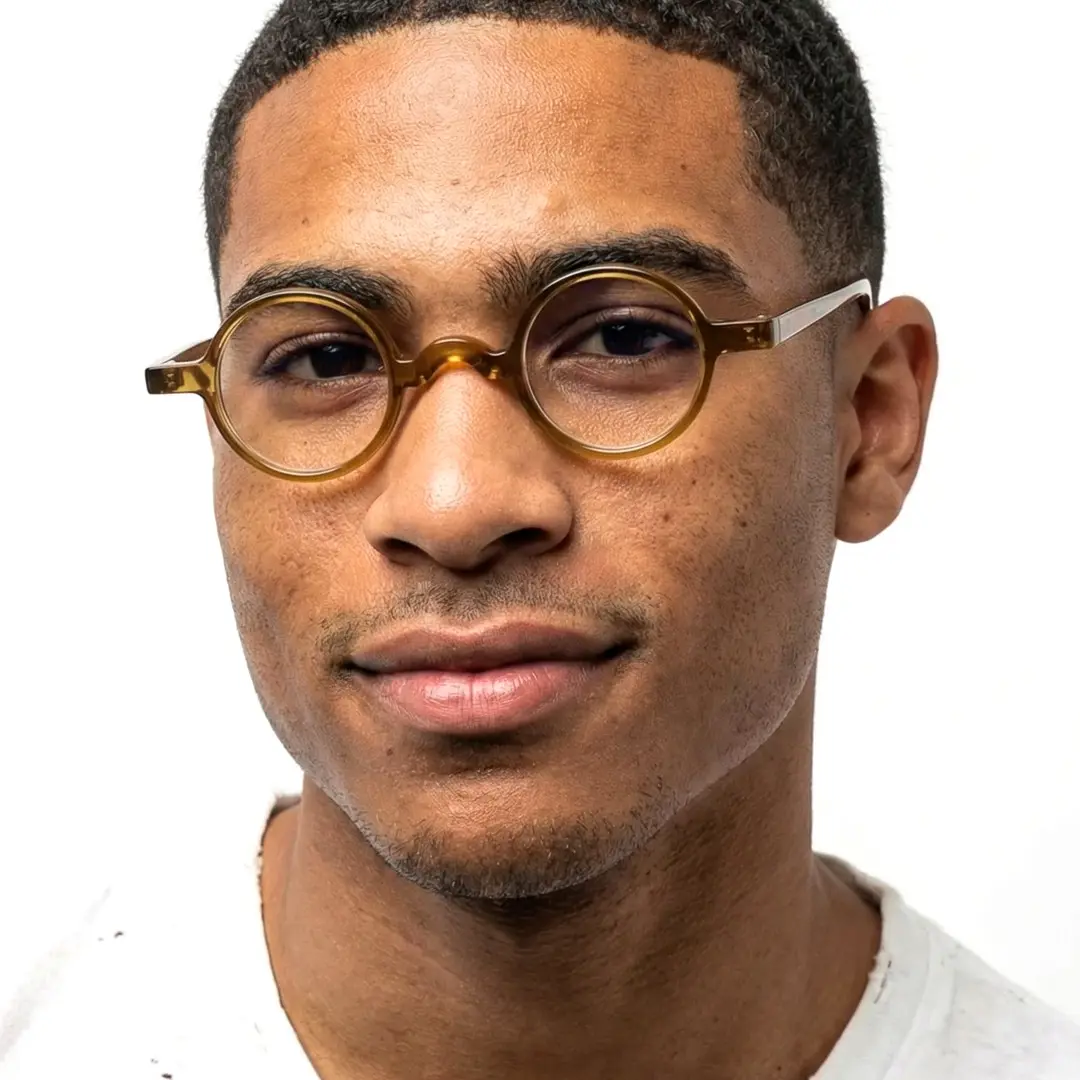 Male wearing vintage bronze round acetate eyeglasses, friendly smile. SPU: RA0402411