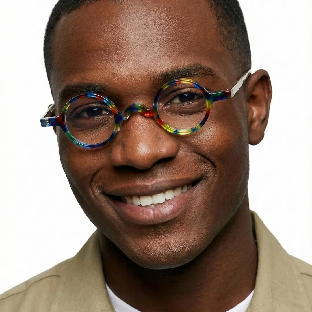 Male wearing vintage multicolor round acetate eyeglasses, smiling. SPU: RA0402411