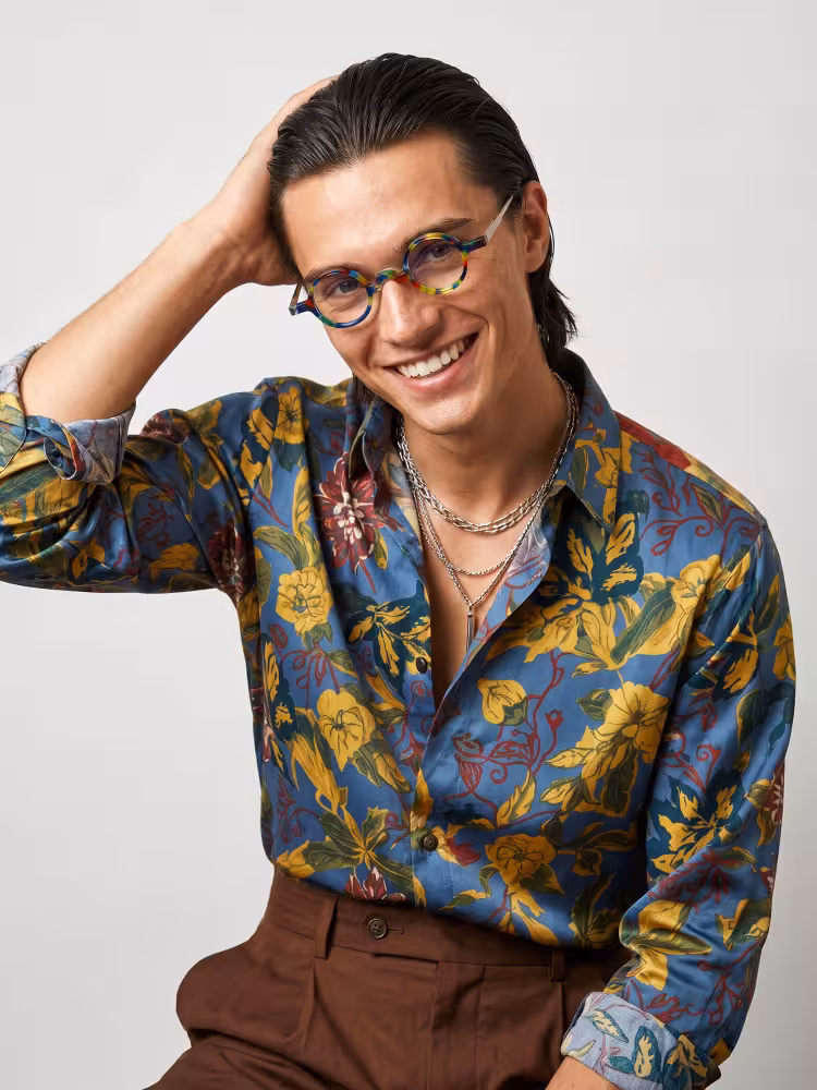 Male model wearing vintage multicolor round acetate eyeglasses in a clean studio setting. SPU: RA0402411