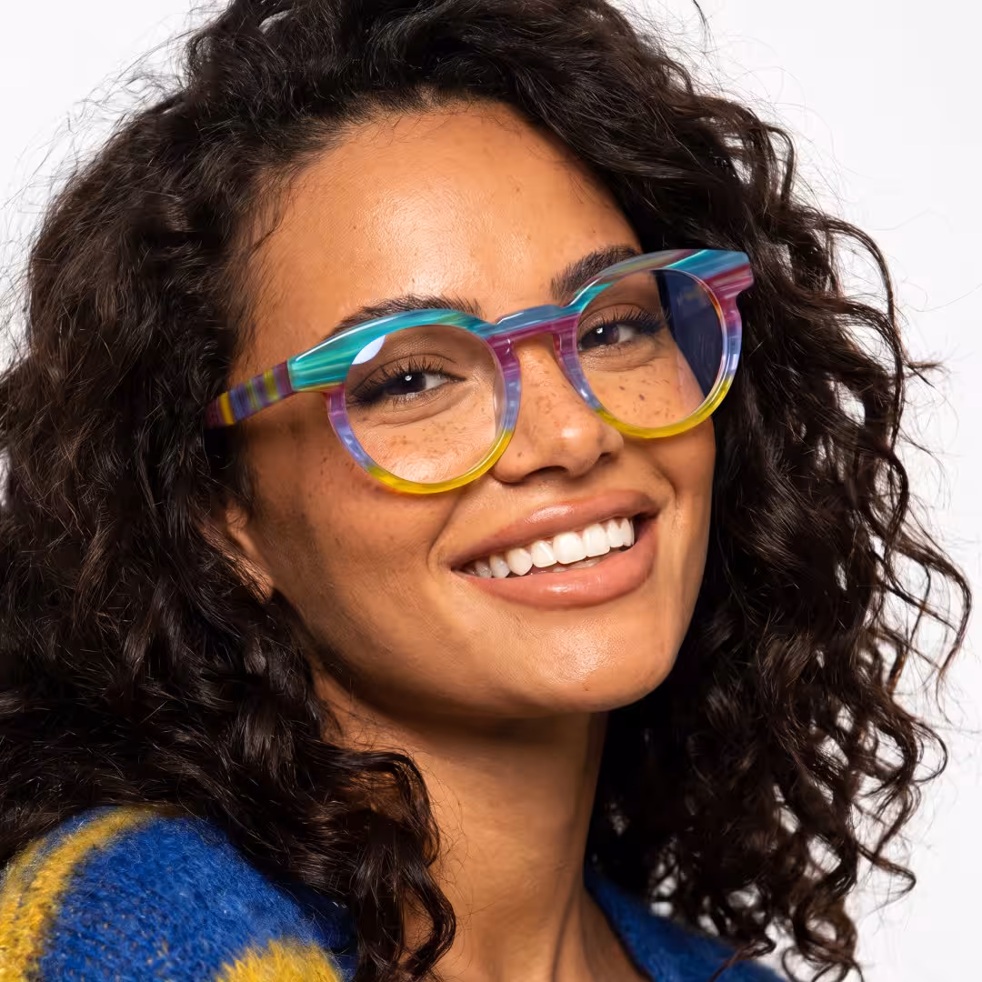 Female wearing colorful multicolor round acetate eyeglasses, smiling. SPU: RA0402605
