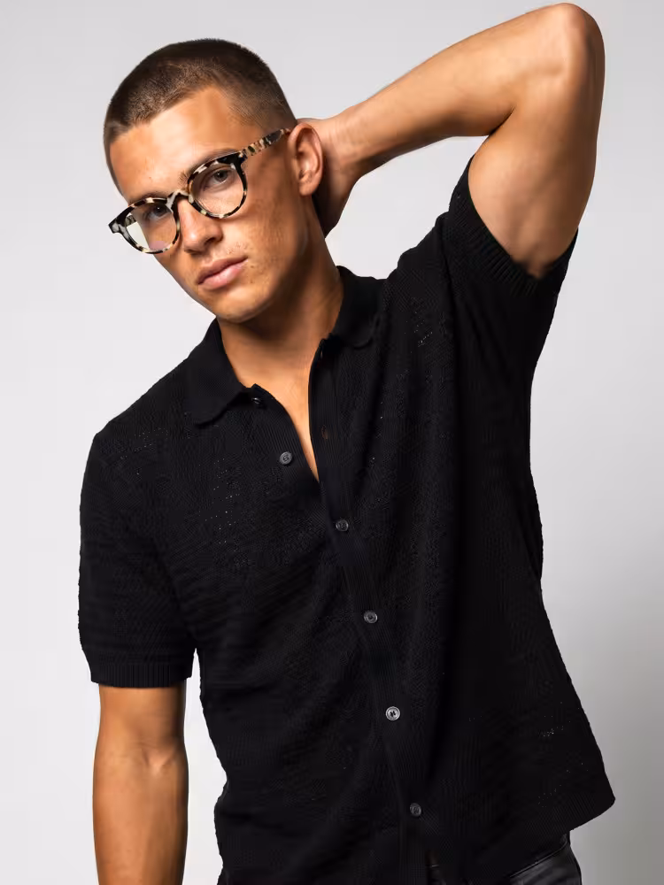 Male model wearing vintage classic tortoise round acetate eyeglasses in studio setting. SPU: RA0402605