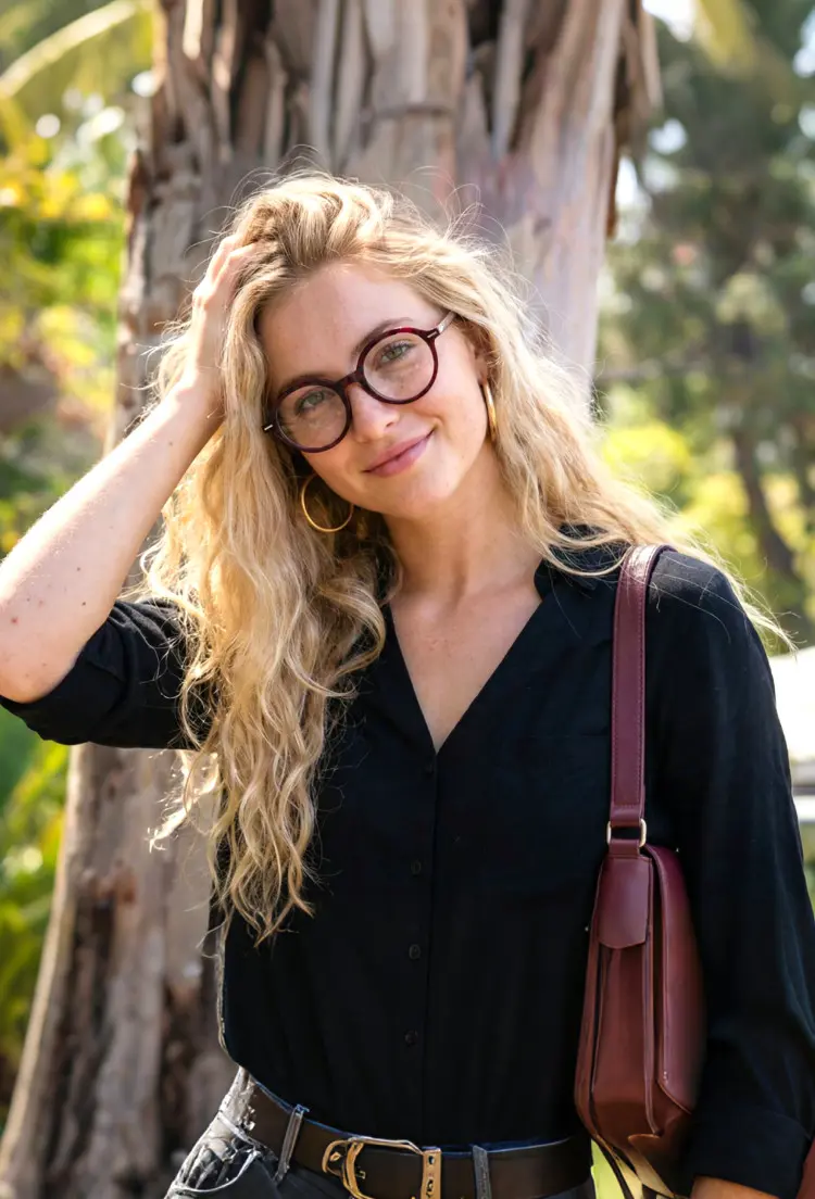 Female model wearing nerd red tortoise round acetate eyeglasses in a park setting with sunlight. SPU: RA0562302