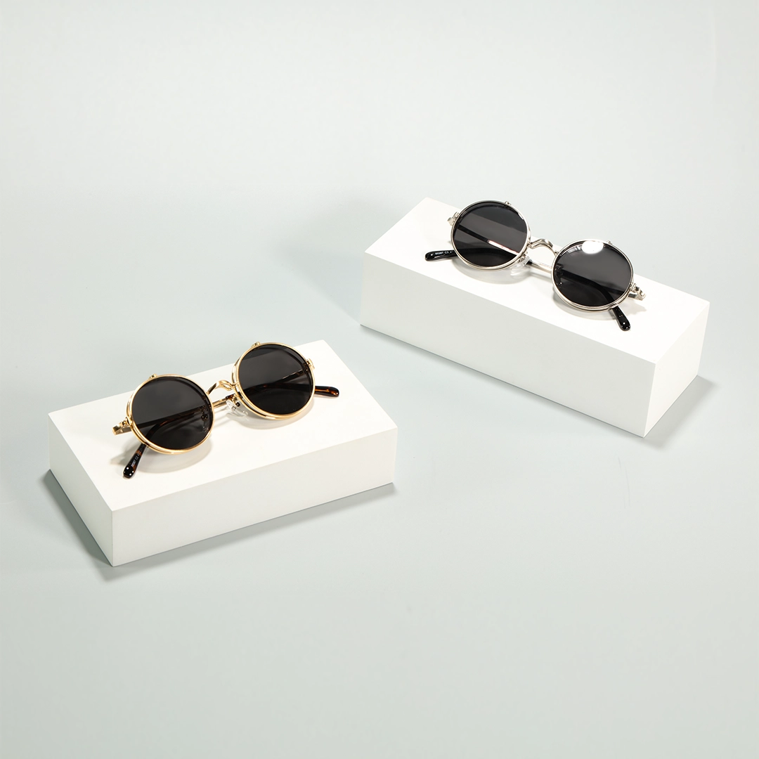 Scene view of Noe round metal flip-up eyeglasses RM0042601 in gold