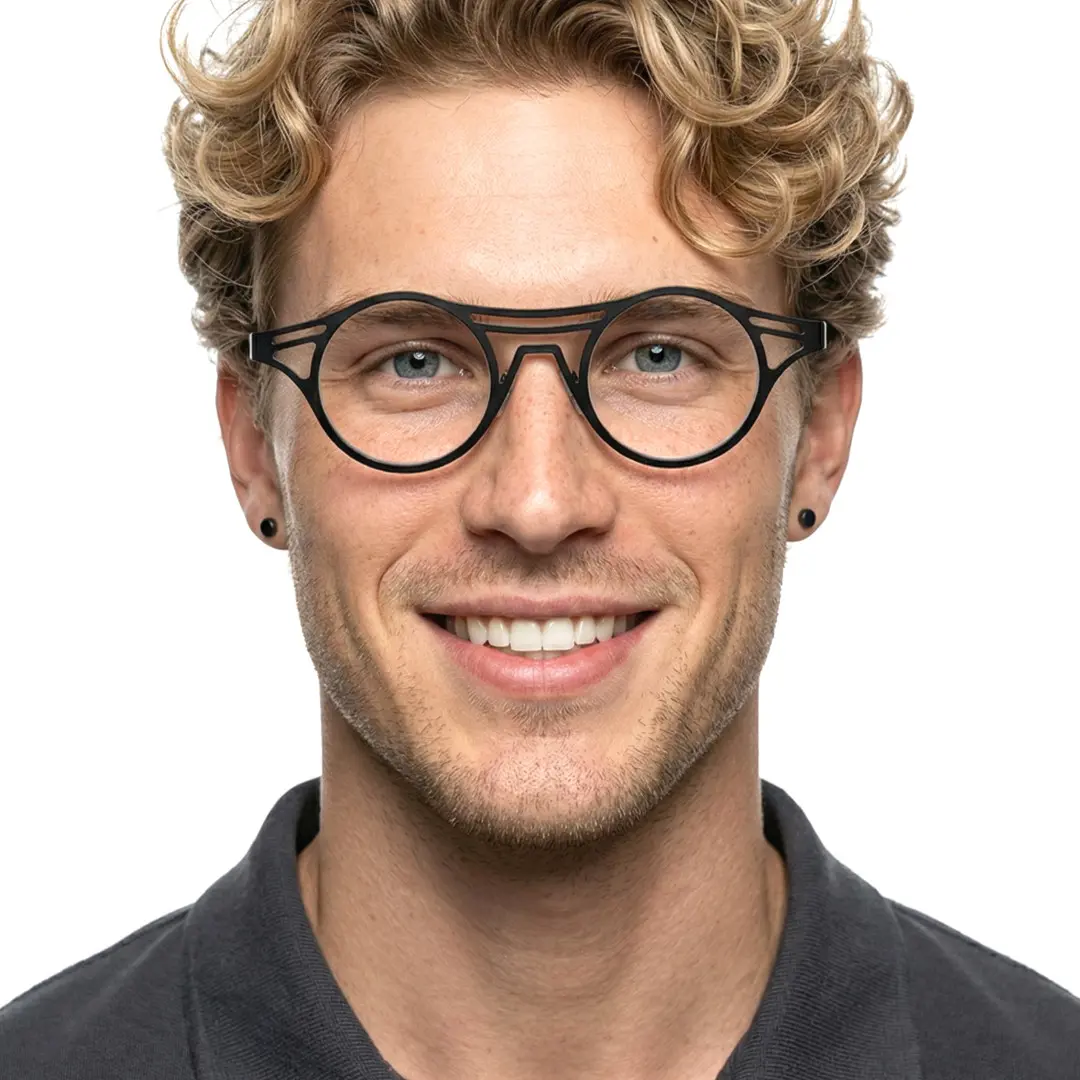 Looking straight ahead view of male wearing black geometric eyeglasses, natural smile, RM0072212