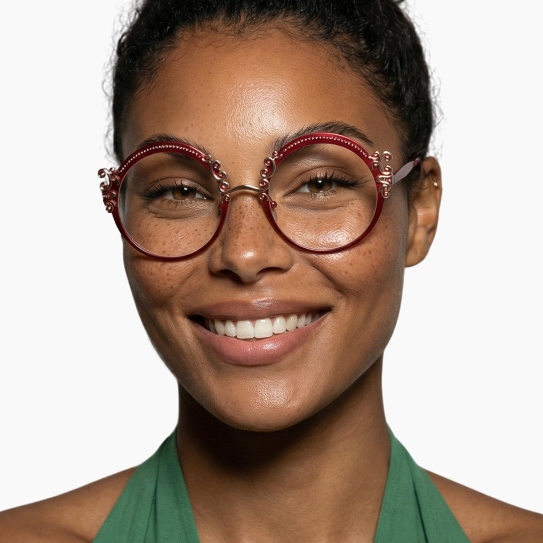 Front view of female wearing vintage red round eyeglasses, smiling, RM0072601