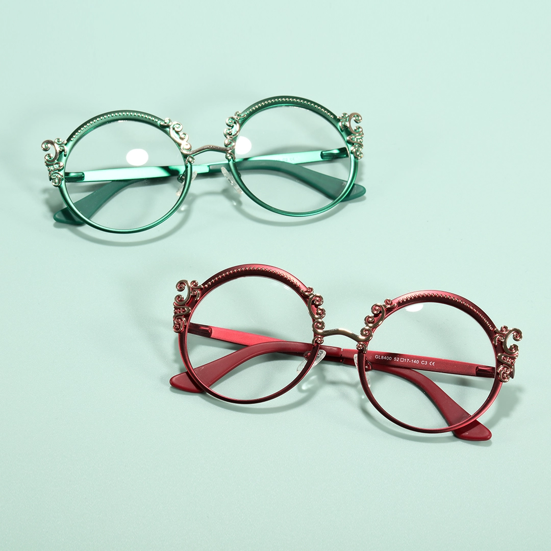 Scene close-up view of Camilla vintage round metal eyeglasses RM0072601 in red