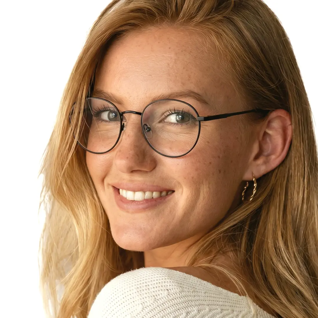 Over-the-shoulder view of female wearing black round eyeglasses, natural smile, RM0082209