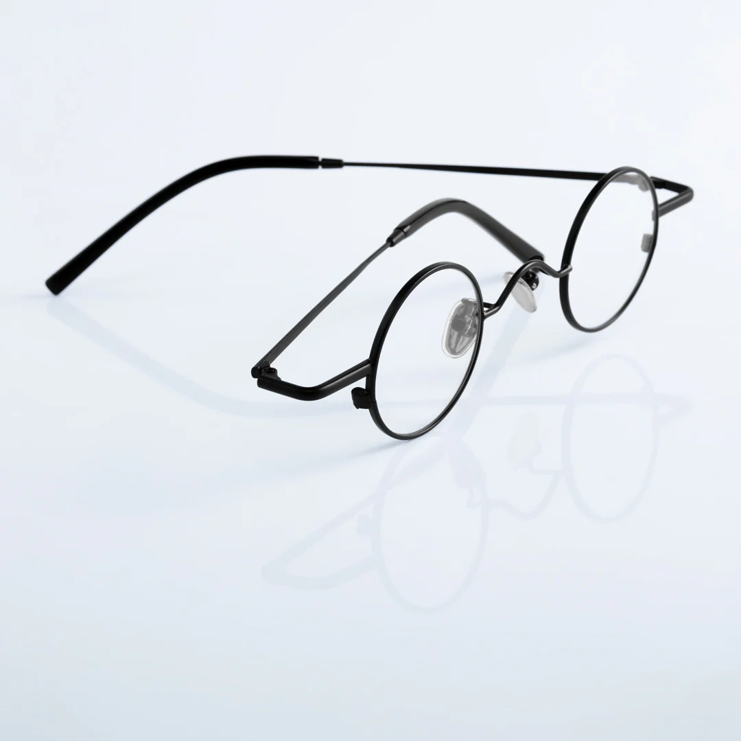 Scene close-up view of Yezy round metal eyeglasses RM0082308 in black