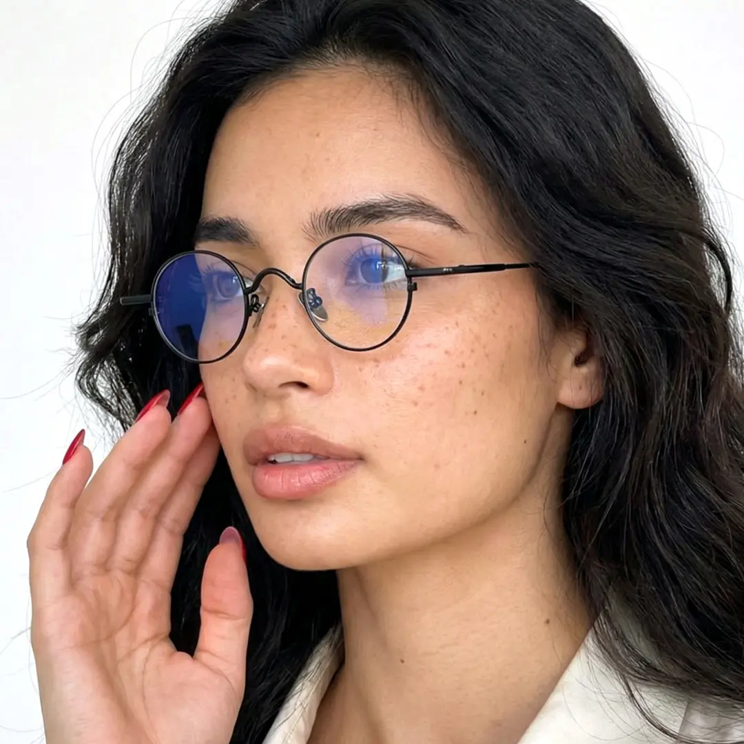 Full profile view of female wearing john lennon black round eyeglasses, hand near face, natural expression, RM0202601