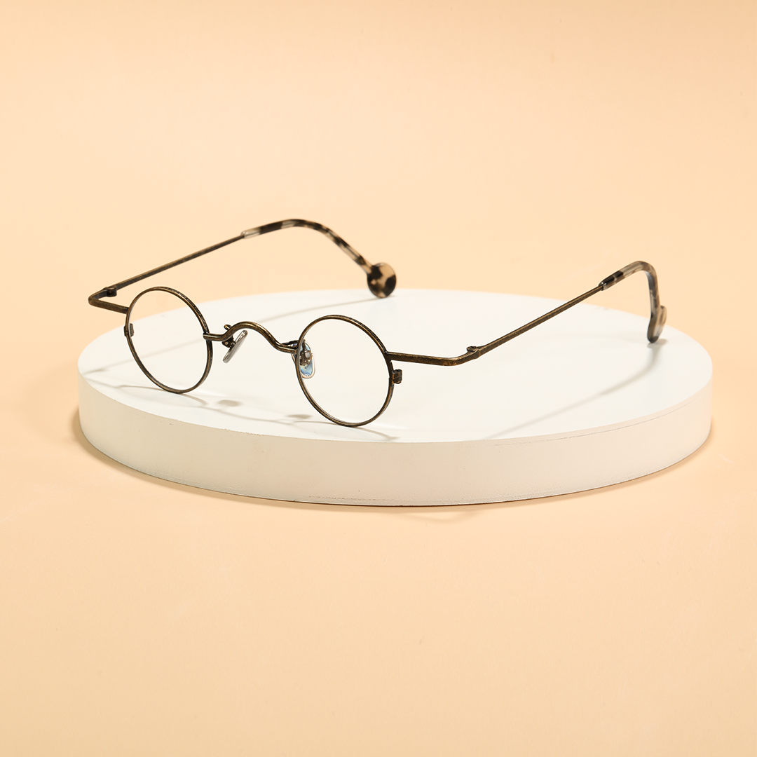 Scene view of Xen vintage round metal eyeglasses RM0242601 in bronze