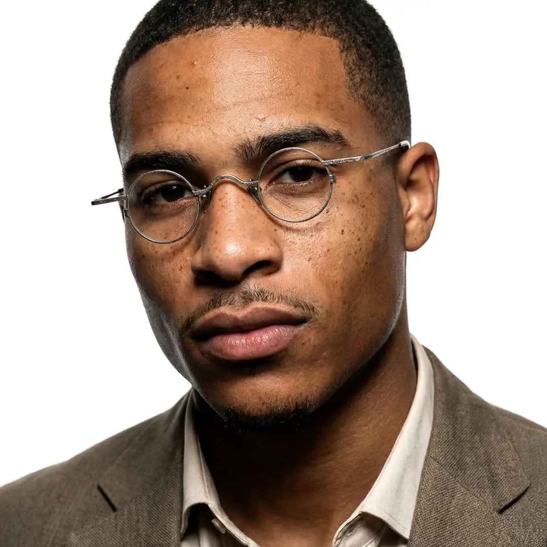 Front view of male wearing vintage silver round eyeglasses, calm expression, RM0242601