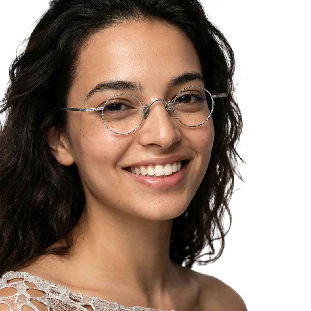Over-the-shoulder view of female wearing vintage silver round eyeglasses, natural smile, RM0242601
