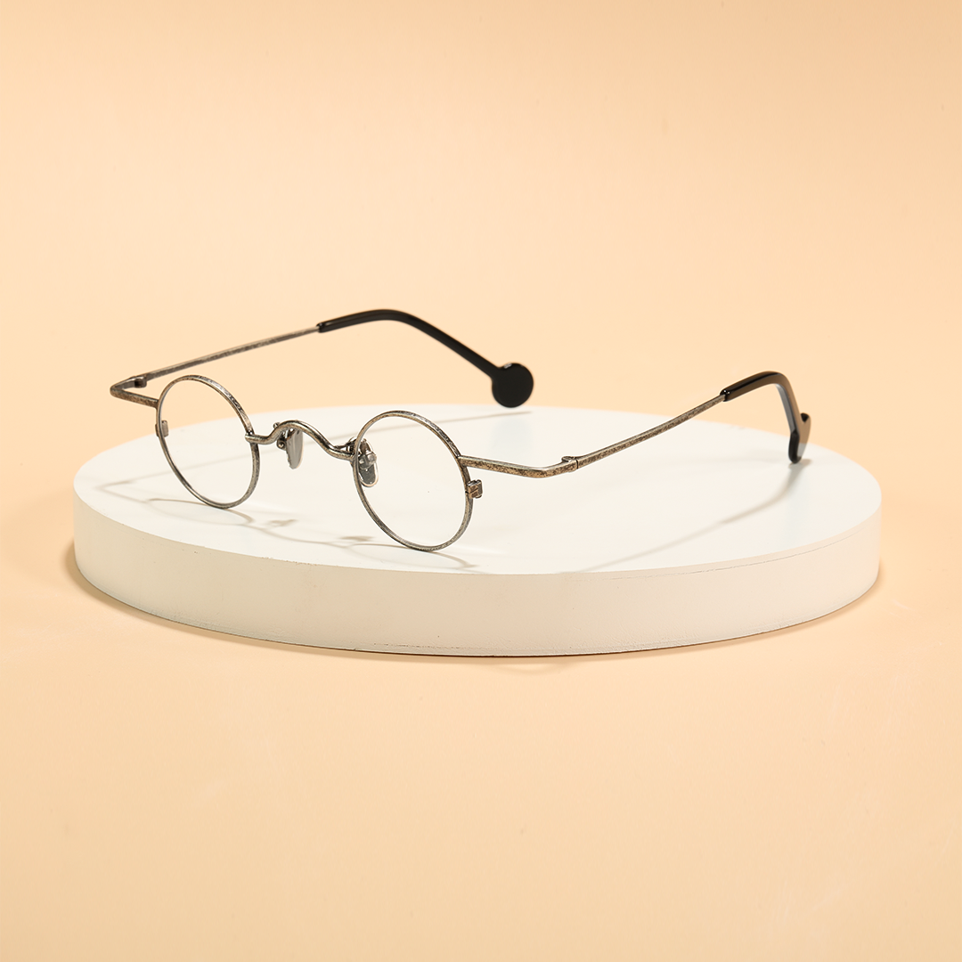 Scene view of Xen vintage round metal eyeglasses RM0242601 in silver