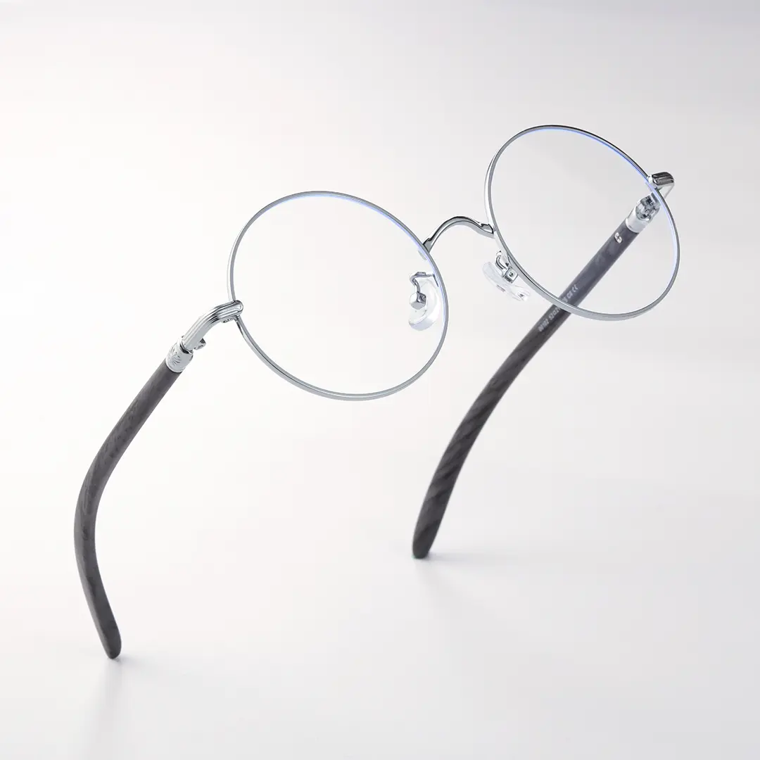 Scene close-up view of Sivigny round metal eyeglasses RM0302407 in silver