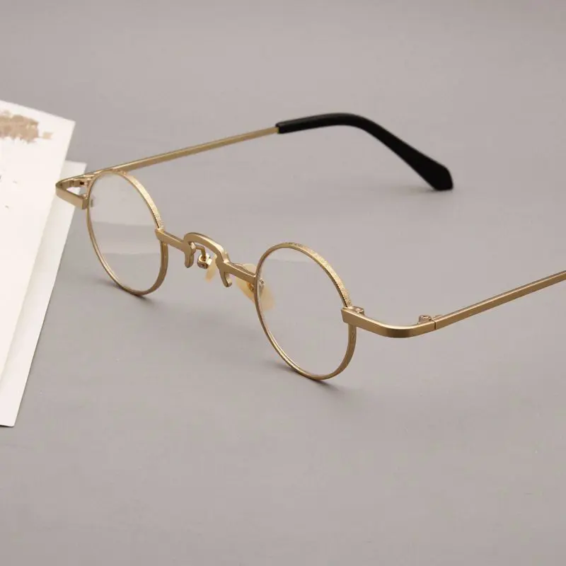 Scene view of Colt john lennon round metal eyeglasses RM0312412 in gold