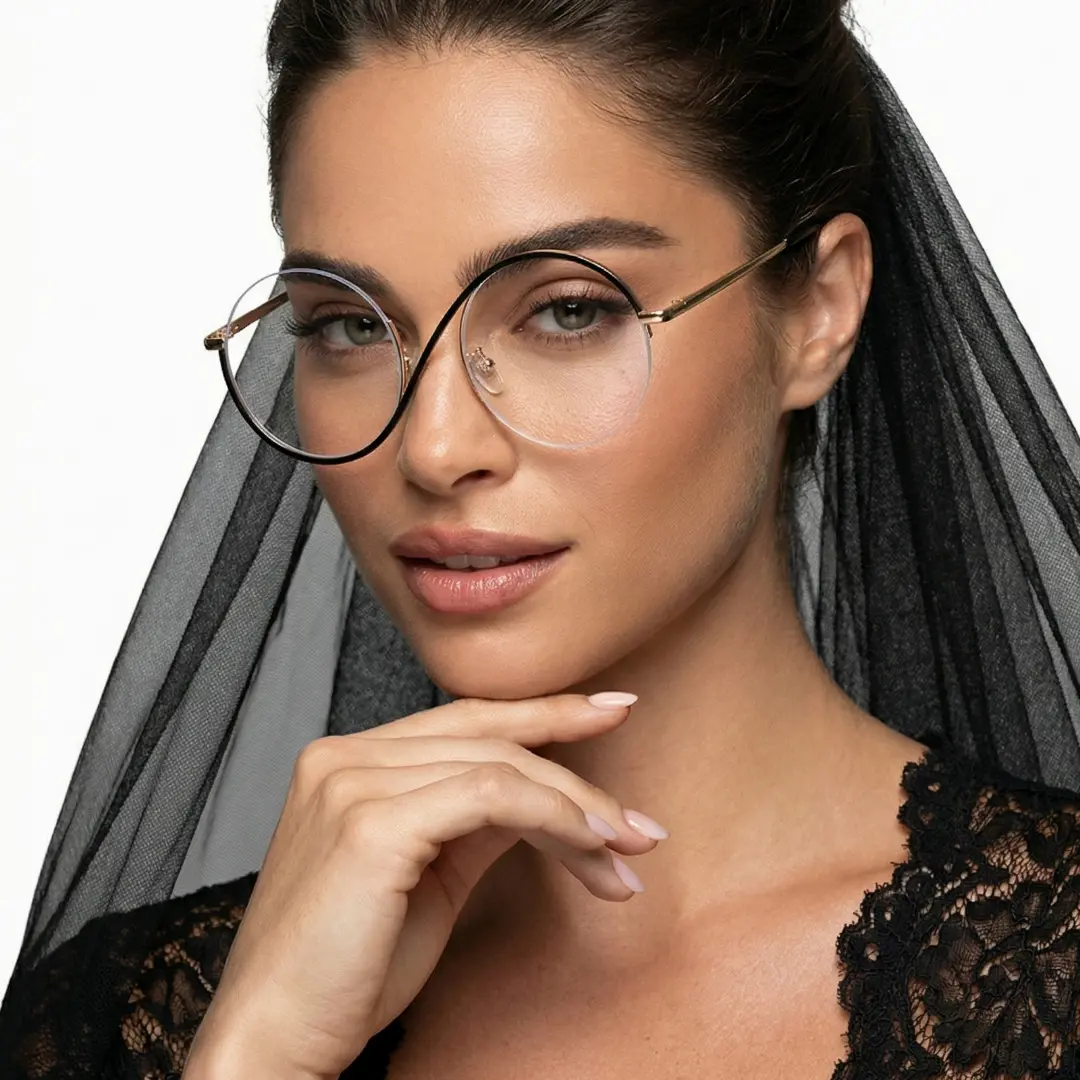 Front view of female wearing black round eyeglasses, resting chin on hand, natural smile, RM0332412