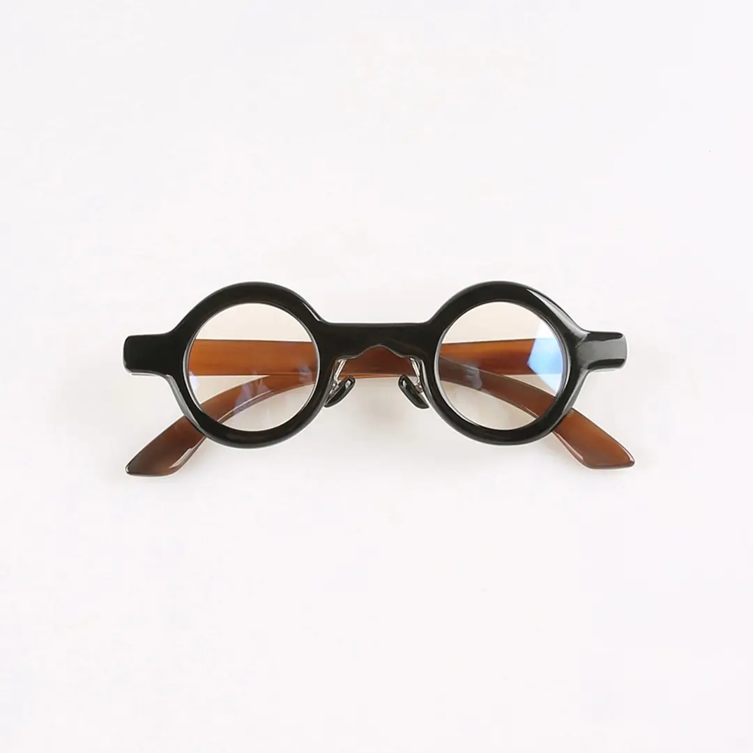 Front folded view of Orbis round natural ox horn handcrafted eyeglasses RO0292511 in black