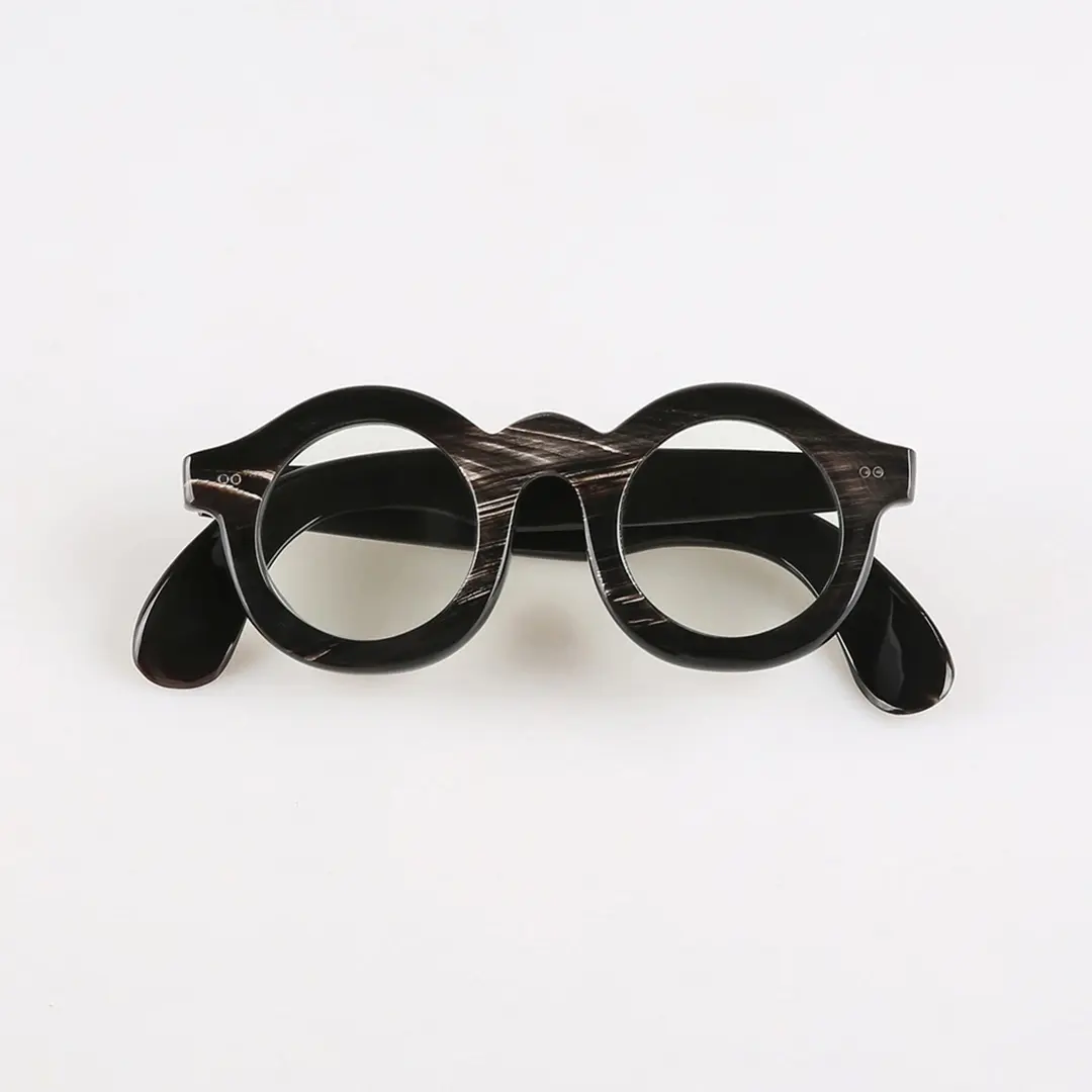 Front folded view of Ember round natural ox horn handcrafted eyeglasses RO0302511 in black