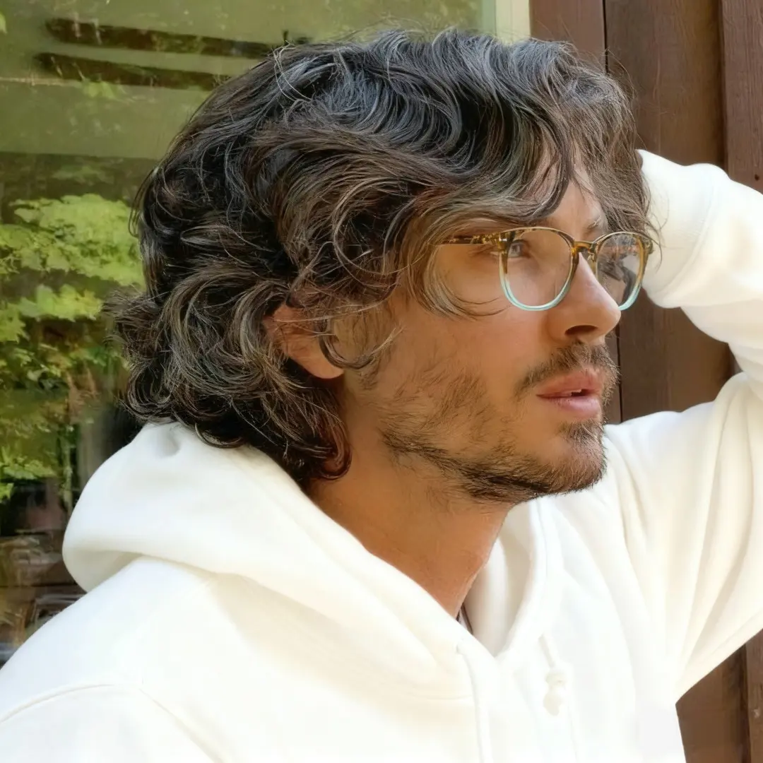 Profile view of male wearing two-tone round eyeglasses, neutral expression, RP0052502