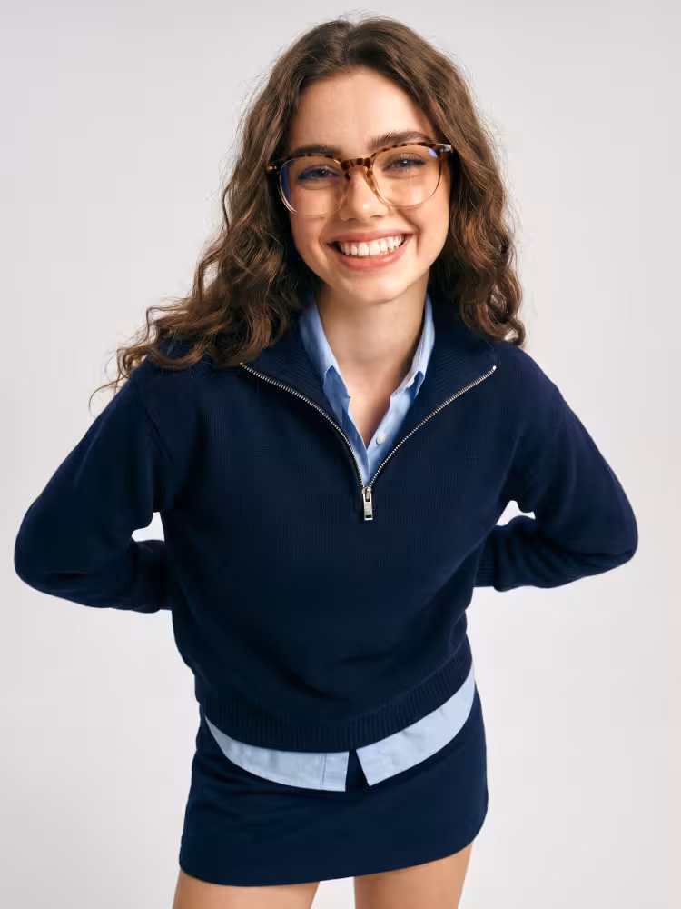 Famale model wearing everyday brown tortoise round pc eyeglasses in a gray studio background. SPU: RP0052502