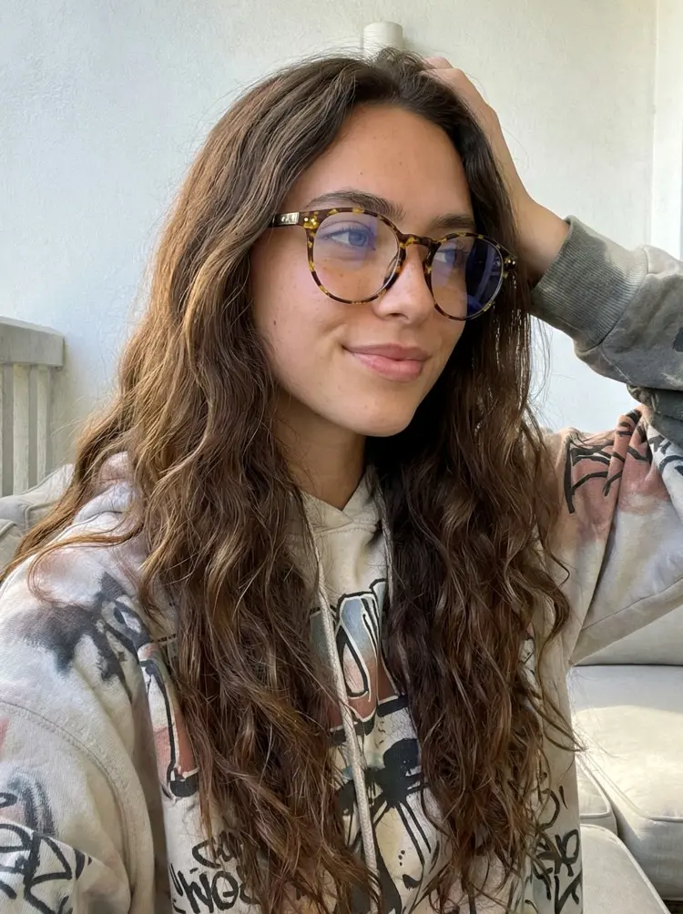 Female model wearing vintage tortoise round tr90 eyeglasses in a living room. SPU: RR0032309