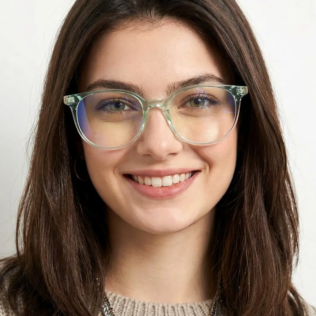 Front view of female wearing green round eyeglasses, natural smile, RR0032408