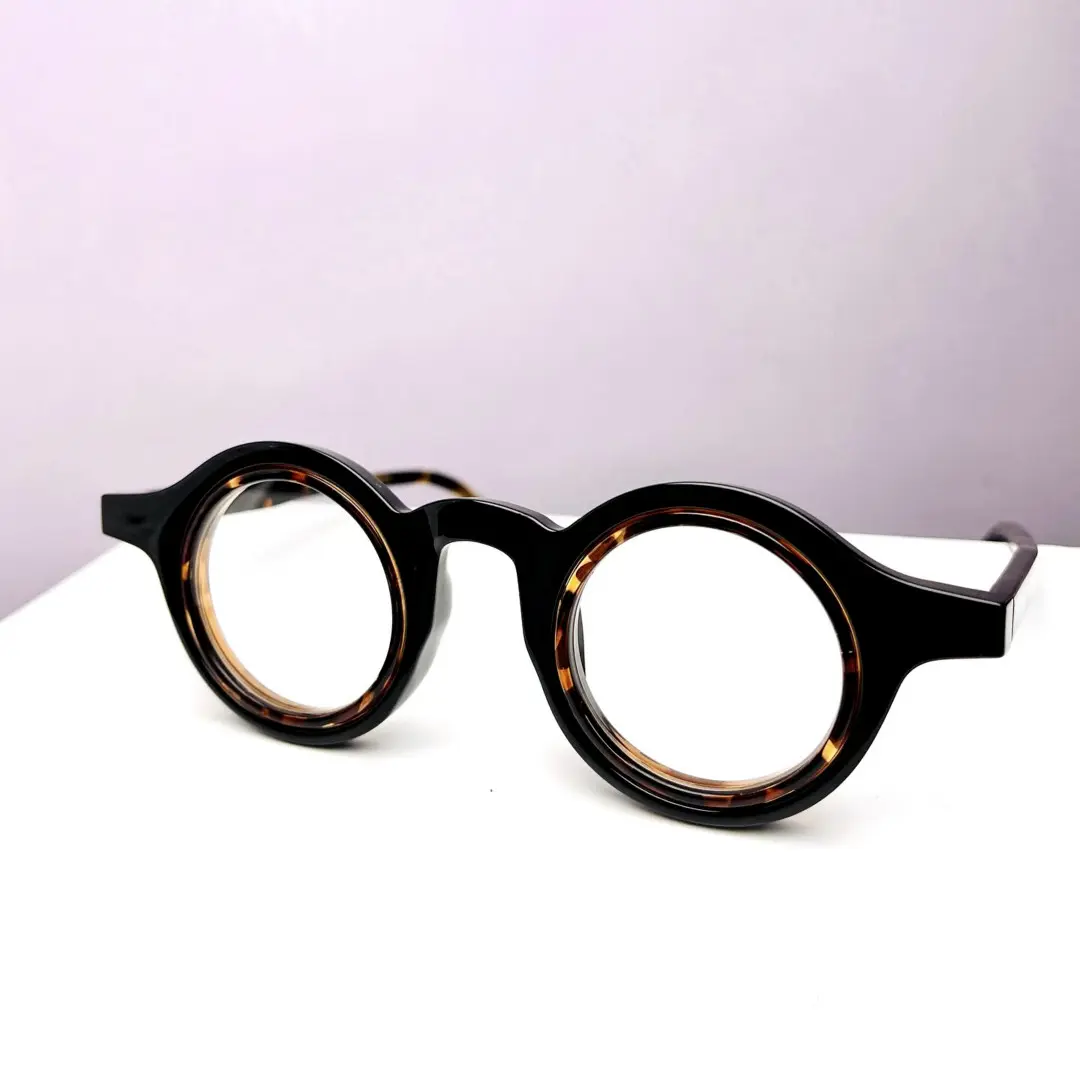 Scene view of Pnora vintage round tr90 eyeglasses RR0032411 in black brown