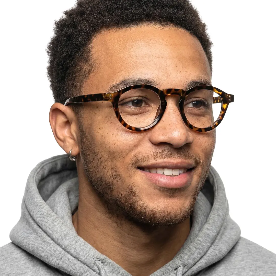 Male wearing vintage tortoise round tr90 eyeglasses, soft smile. SPU: RR0042411
