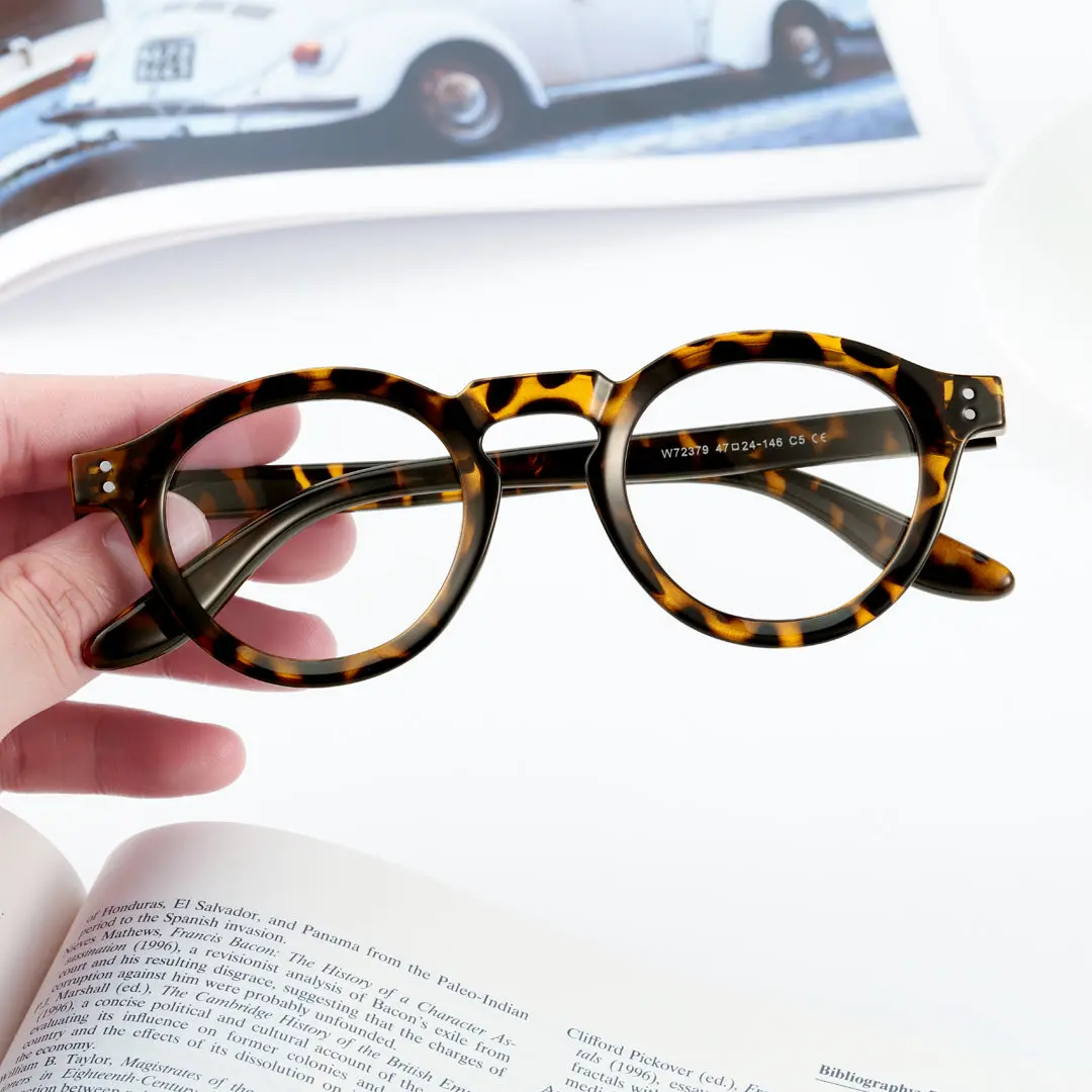 Scene view of Pnova vintage round tr90 eyeglasses in tortoise. SPU: RR0042411