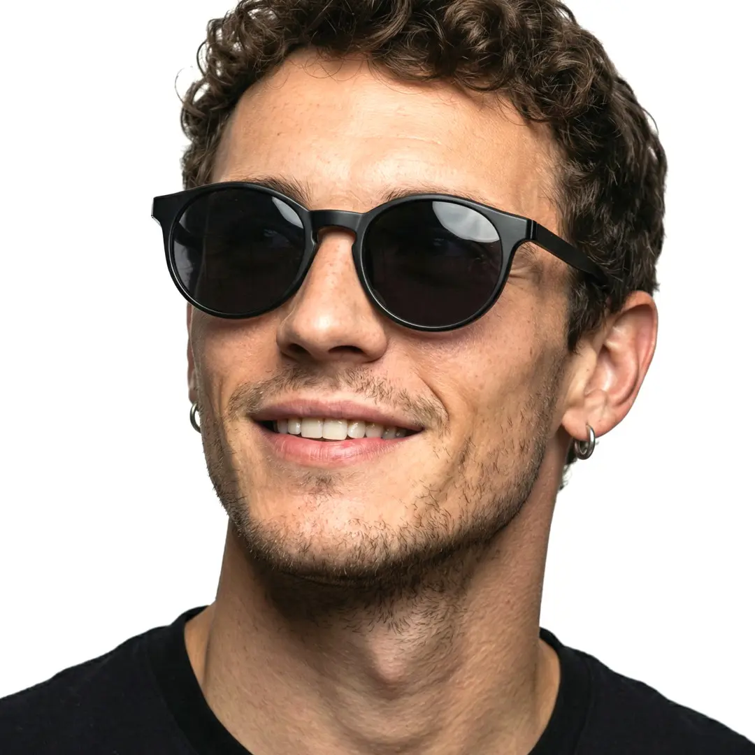 Three-quarter view of male wearing black round magnetic clip-on eyeglasses set with interchangeable clip-on lenses, smiling, RR0042512