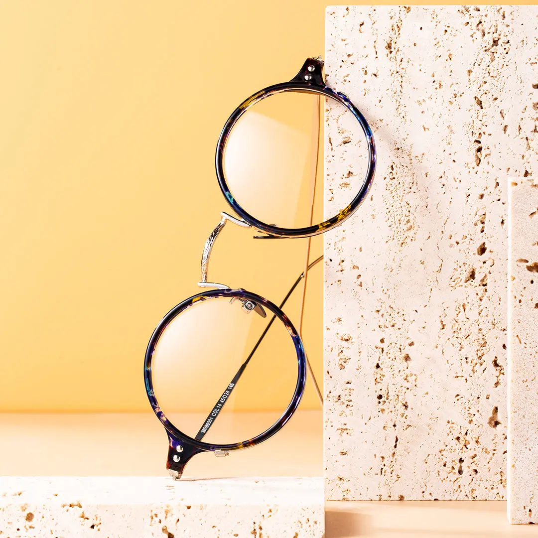 Scene close-up view of Guts vintage round tr90 eyeglasses in blue tortoise. SPU: RR0072308