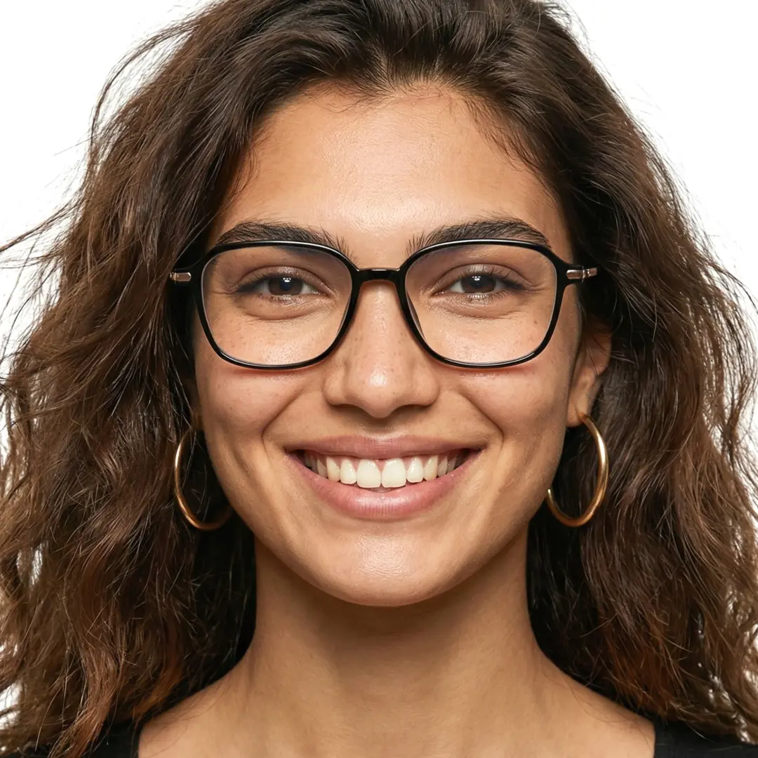 Front view of female wearing black round eyeglasses, wide smile, RR0072412