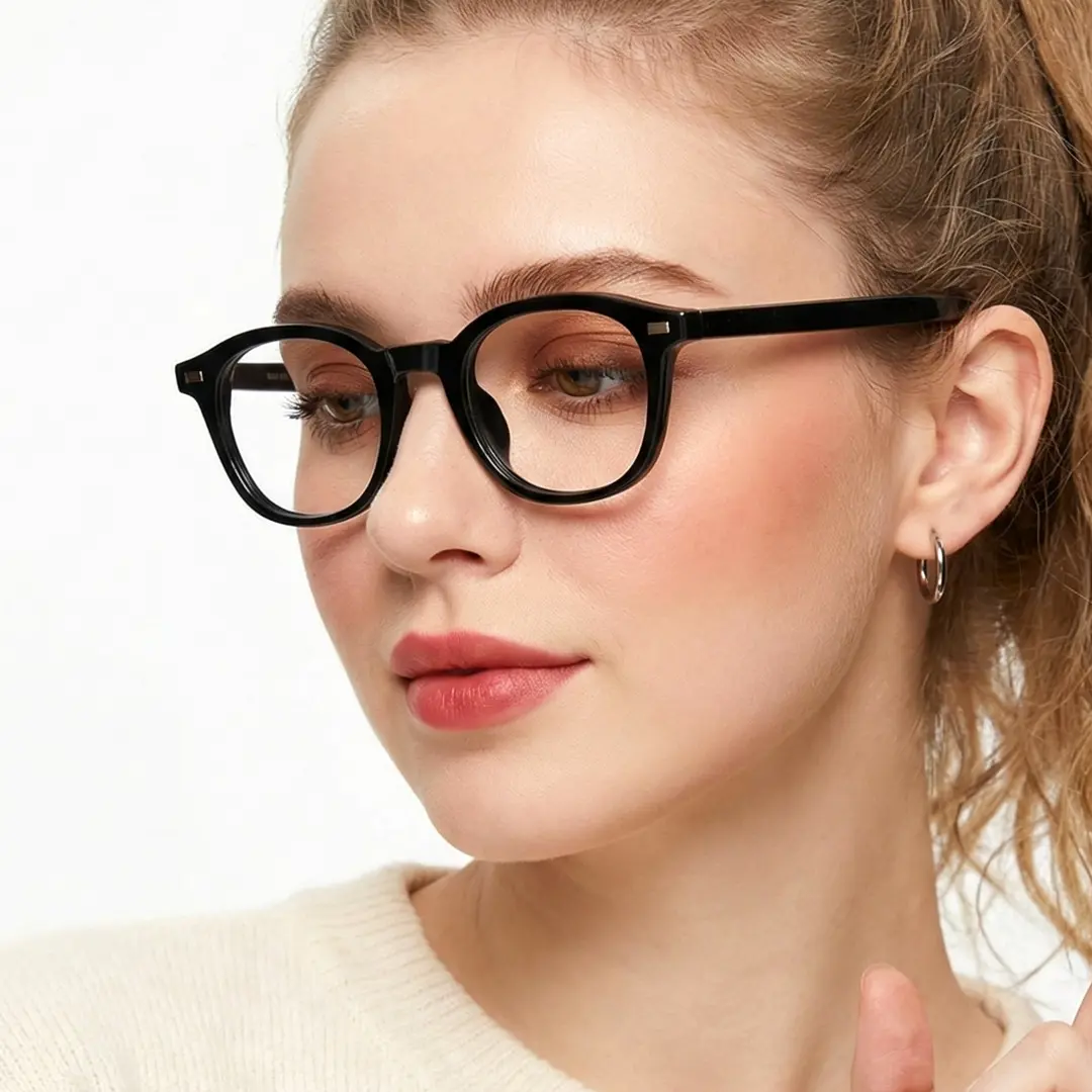 Three-quarter view of female wearing black round eyeglasses, relaxed expression, RR0082412