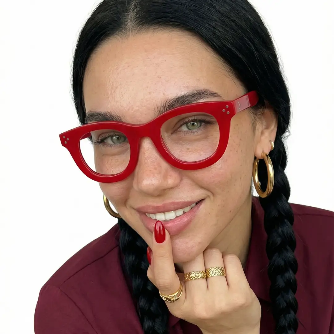 Front view of female wearing red round eyeglasses, smiling, RR0102404