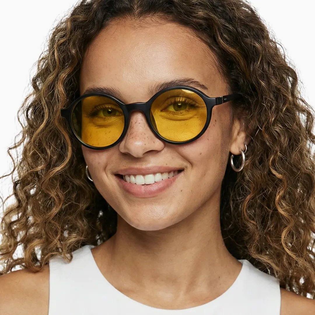 Front view of female wearing black round magnetic clip-on eyeglasses set with interchangeable clip-on lenses, smiling, RR0112601