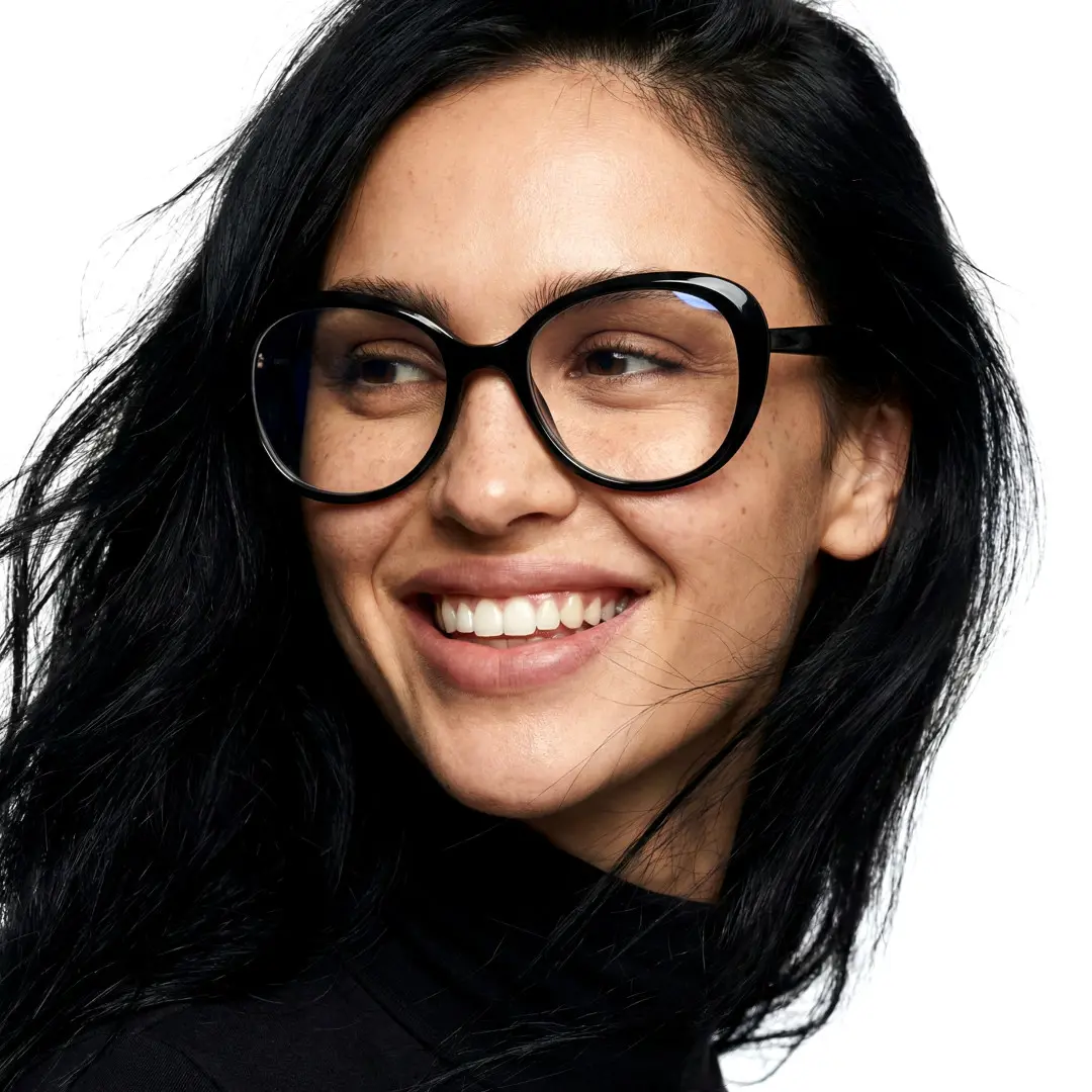 Front view of female wearing black round eyeglasses, smiling, RR0122502