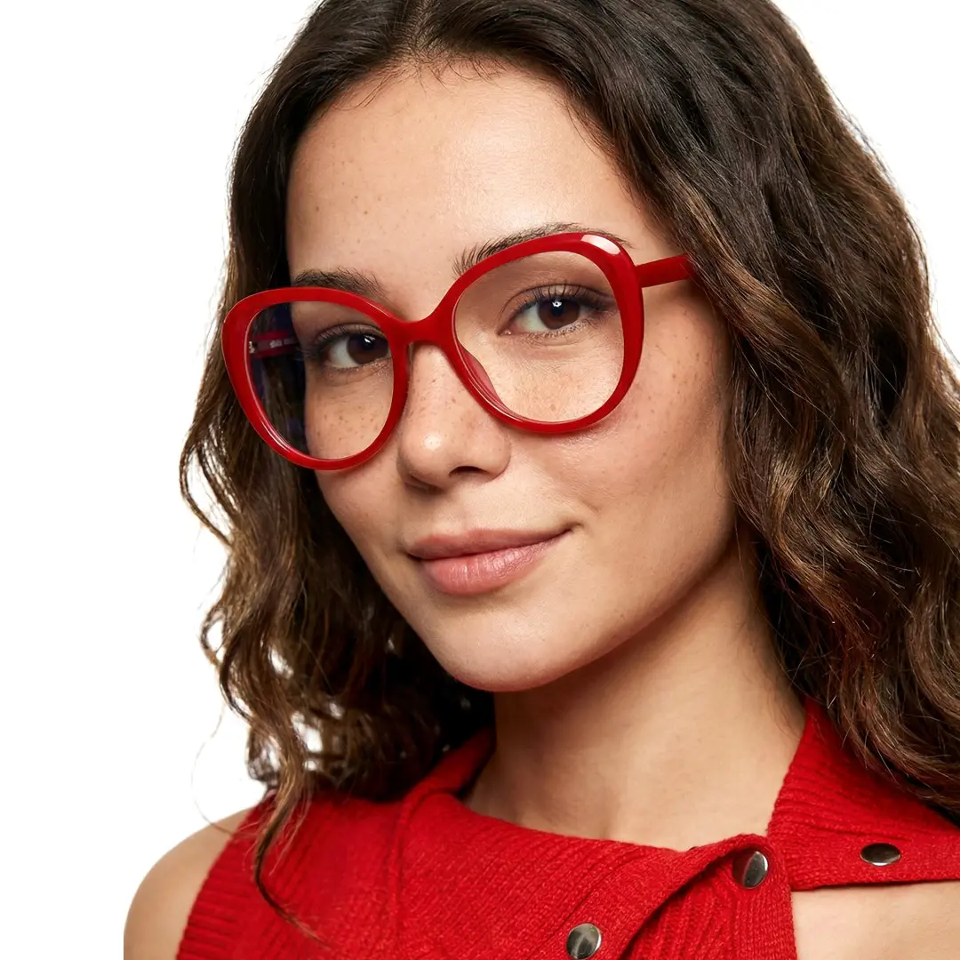 Front view of female wearing red round eyeglasses, soft smile, RR0122502