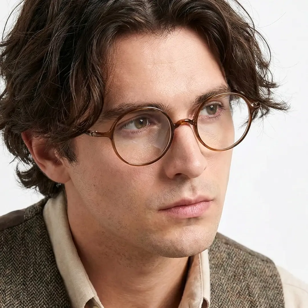 Looking away view of male wearing john lennon brown round eyeglasses, neutral expression, RR0192410