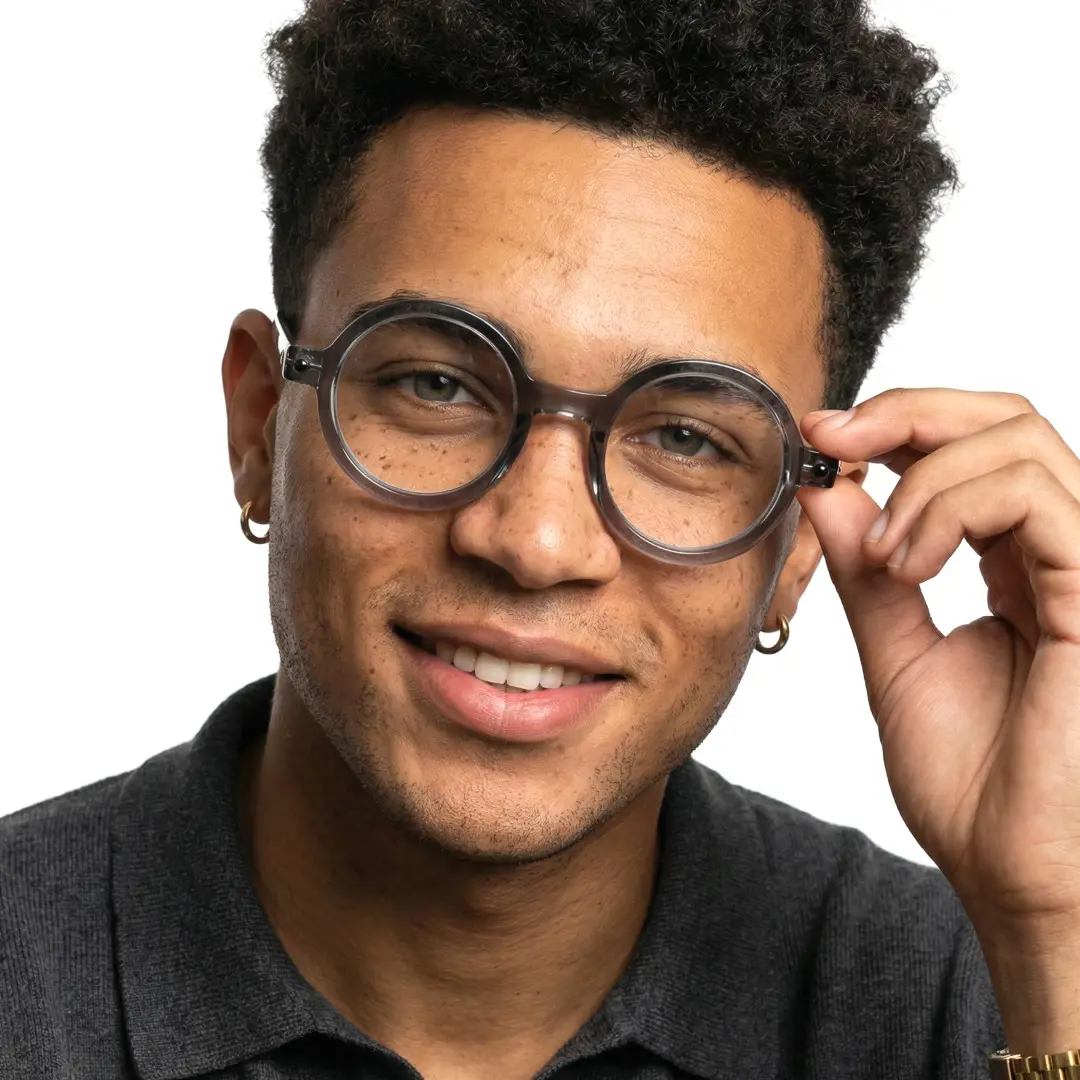 Front view of male wearing grey round eyeglasses, adjusting glasses, friendly smile, RR0212302