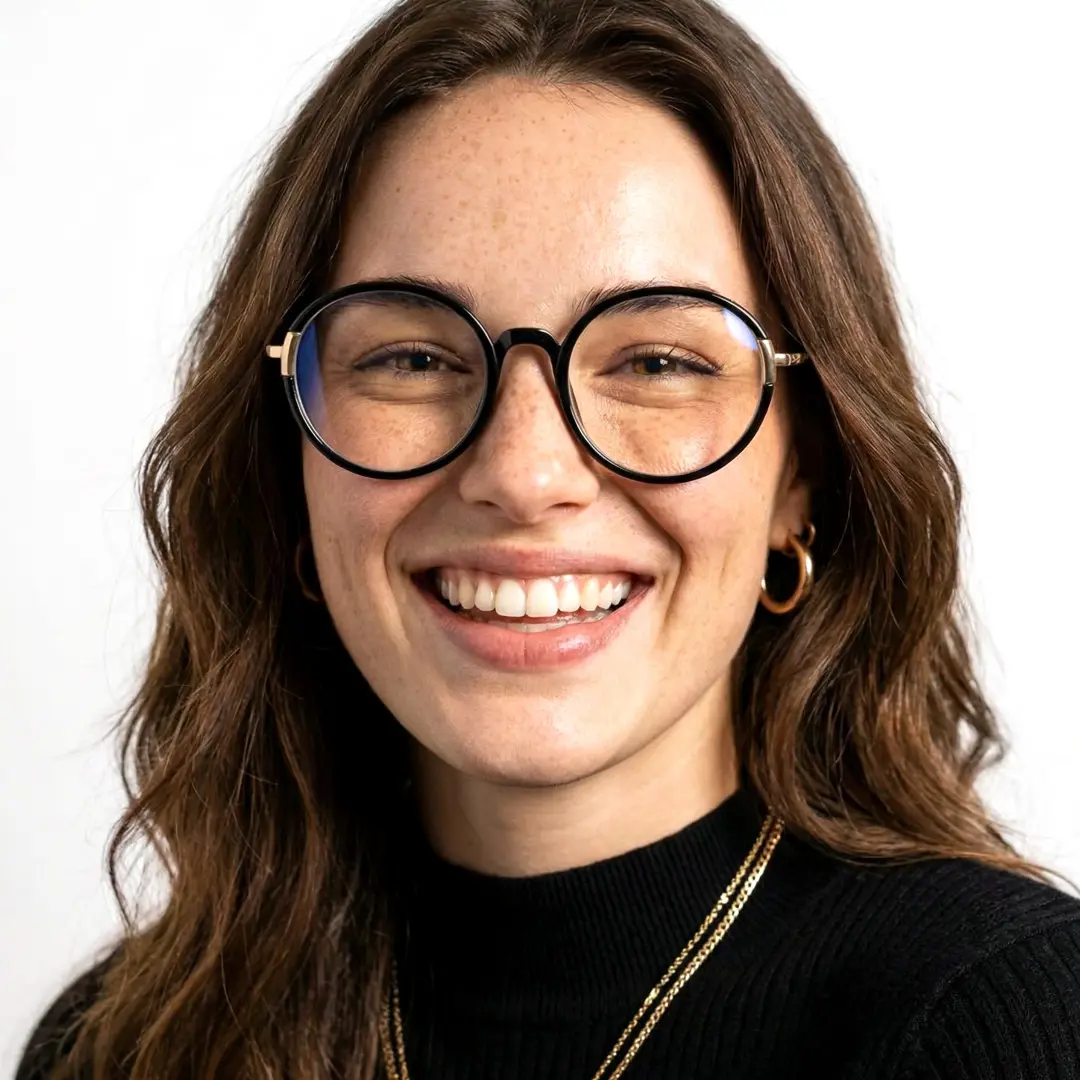 Front view of female wearing black round eyeglasses, smiling, RR0262411