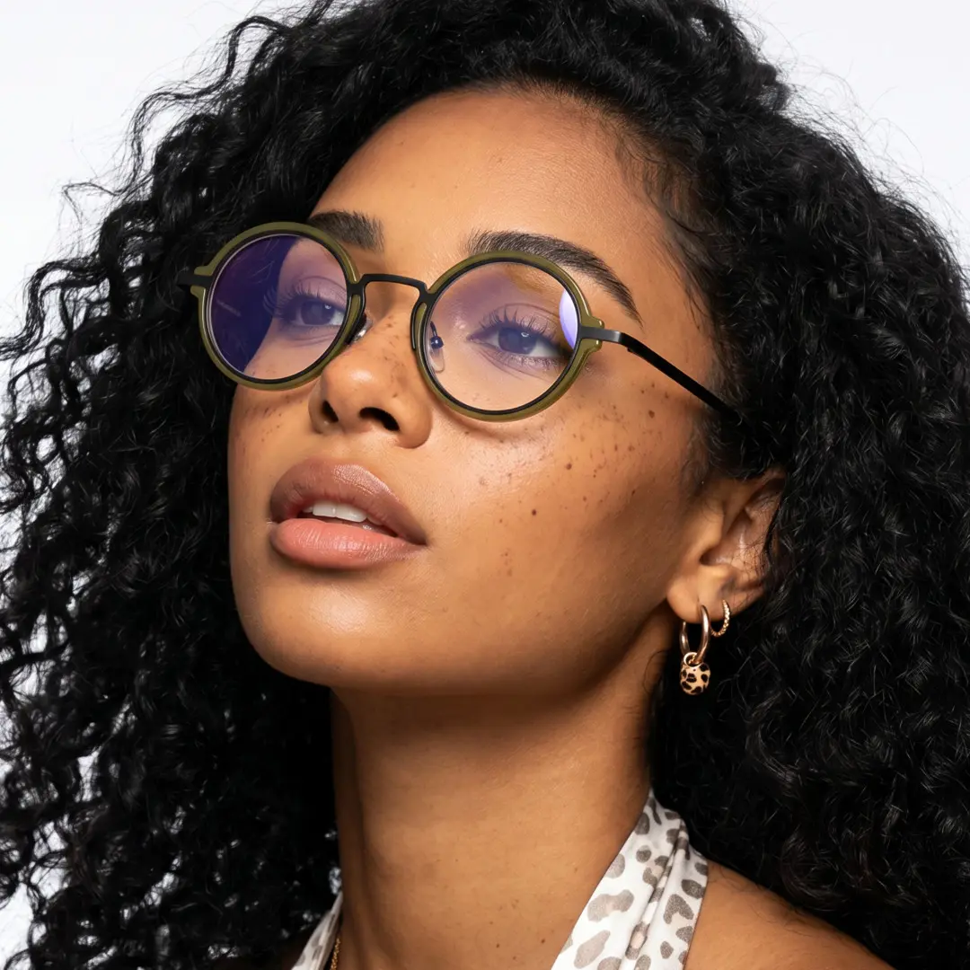 Three-quarter view of female wearing vintage army green round eyeglasses, relaxed expression, RR0312406