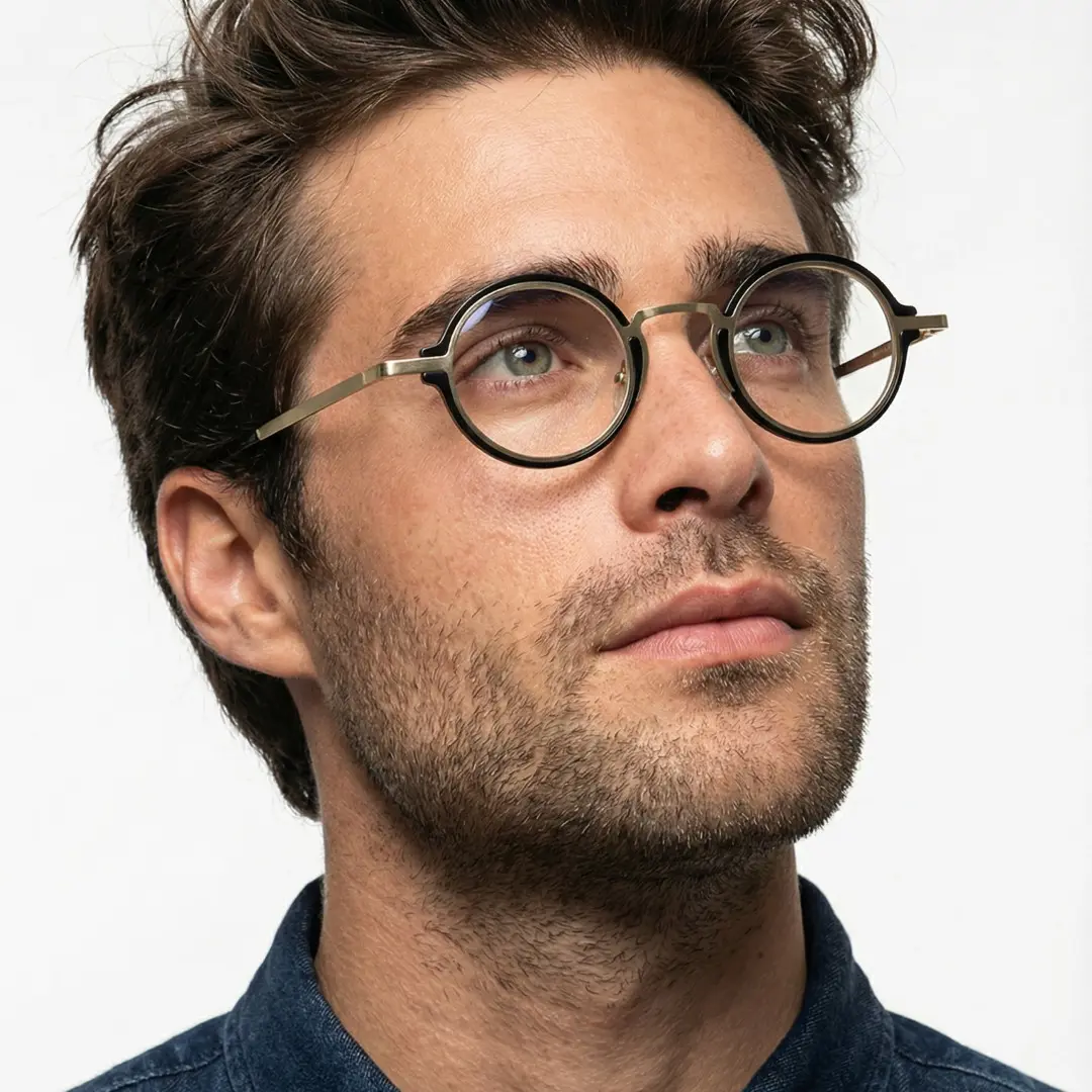 Close-up view of male wearing black round eyeglasses, thoughtful expression, RR0312406