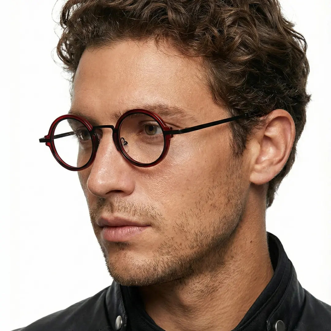 Profile view of male wearing red round eyeglasses, confident expression, RR0312406